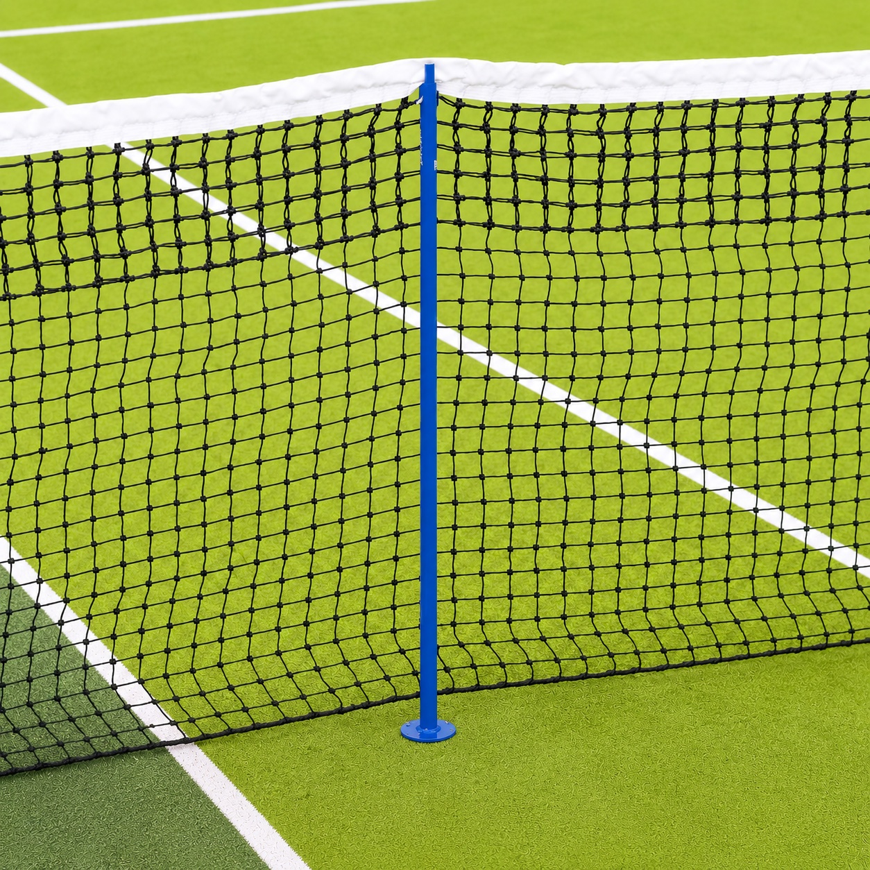 A singles stick propping up the tennis net at the singles sideline on a green hard court